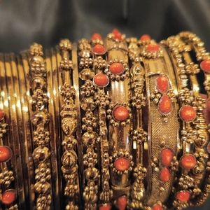 Gold bangles with beautiful orange inlay stones